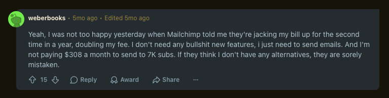 Screenshot of a Reddit comment criticizing Mailchimp's pricing structure and fee increases.